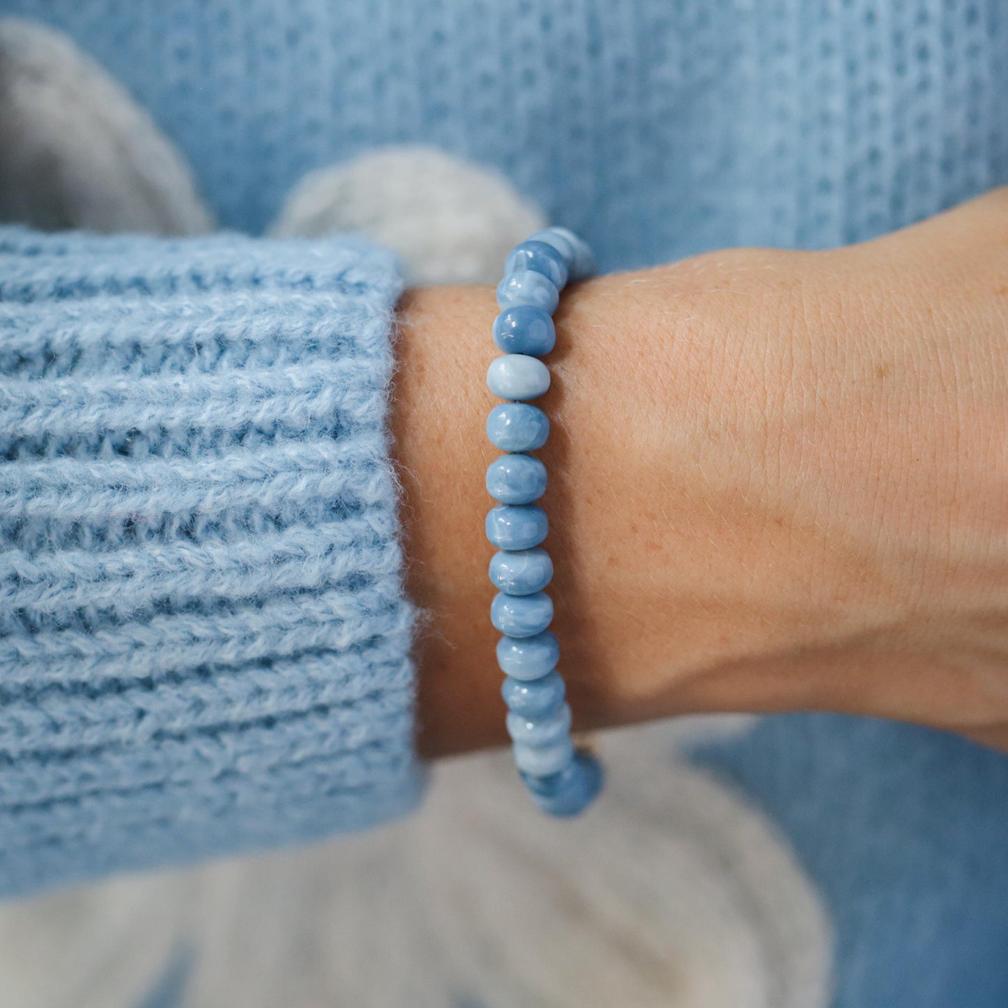 Blue Opal bracelet by Earthly Abundance featuring polished oval blue opal stones on a delicate silver chain.