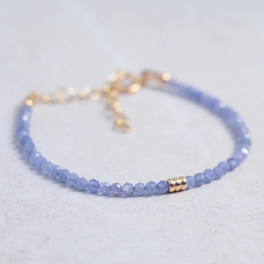 3mm AAA Tanzanite bracelet by Earthly Abundance featuring round, vibrant blue tanzanite gemstones on a delicate bracelet.