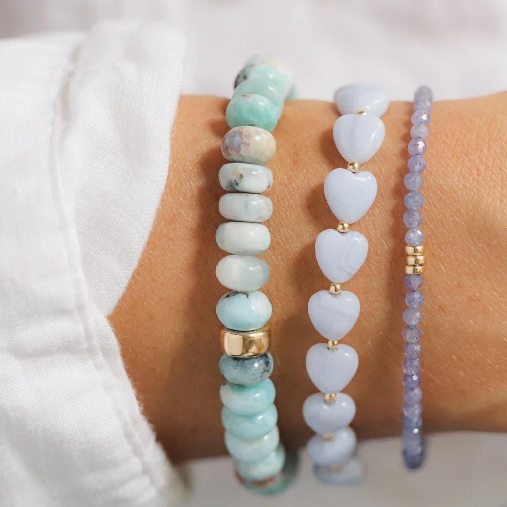 3mm AAA Tanzanite bracelet featuring vibrant blue gemstones on a delicate silver chain, by Earthly Abundance.