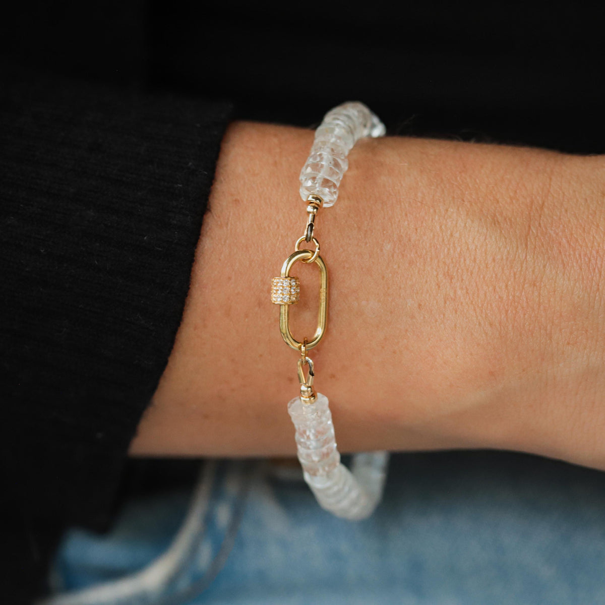 White topaz carabiner bracelet by Earthly Abundance featuring sparkling gemstones and a sleek metal clasp.