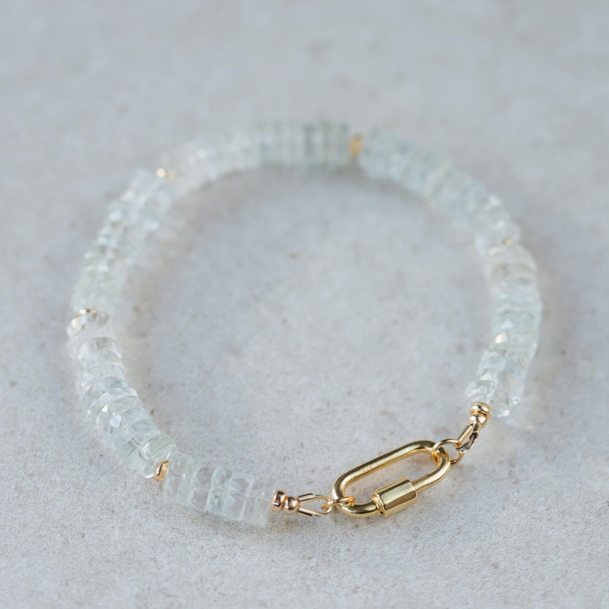 White topaz carabiner bracelet by Earthly Abundance featuring sparkling gemstones and a sleek silver design.