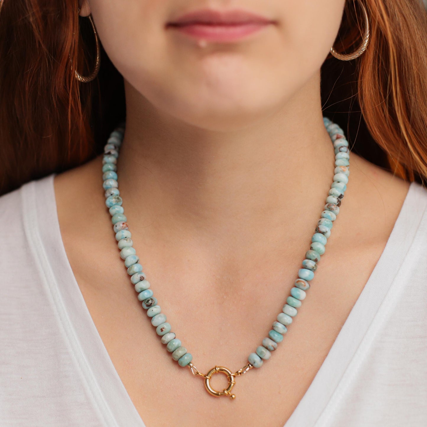 Larimar toggle necklace by Earthly Abundance featuring a blue gemstone pendant on a silver chain.