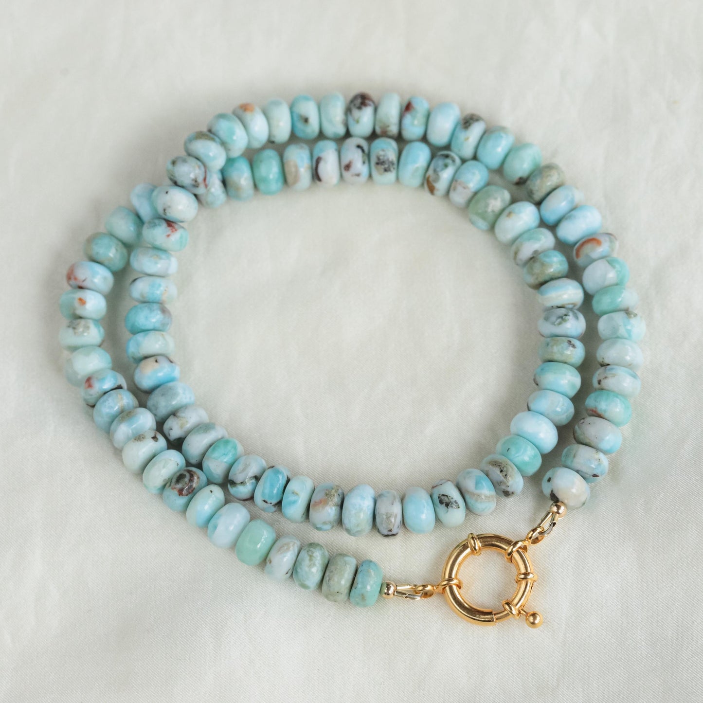 Larimar toggle necklace by Earthly Abundance featuring a vibrant blue larimar gemstone pendant on a silver chain.