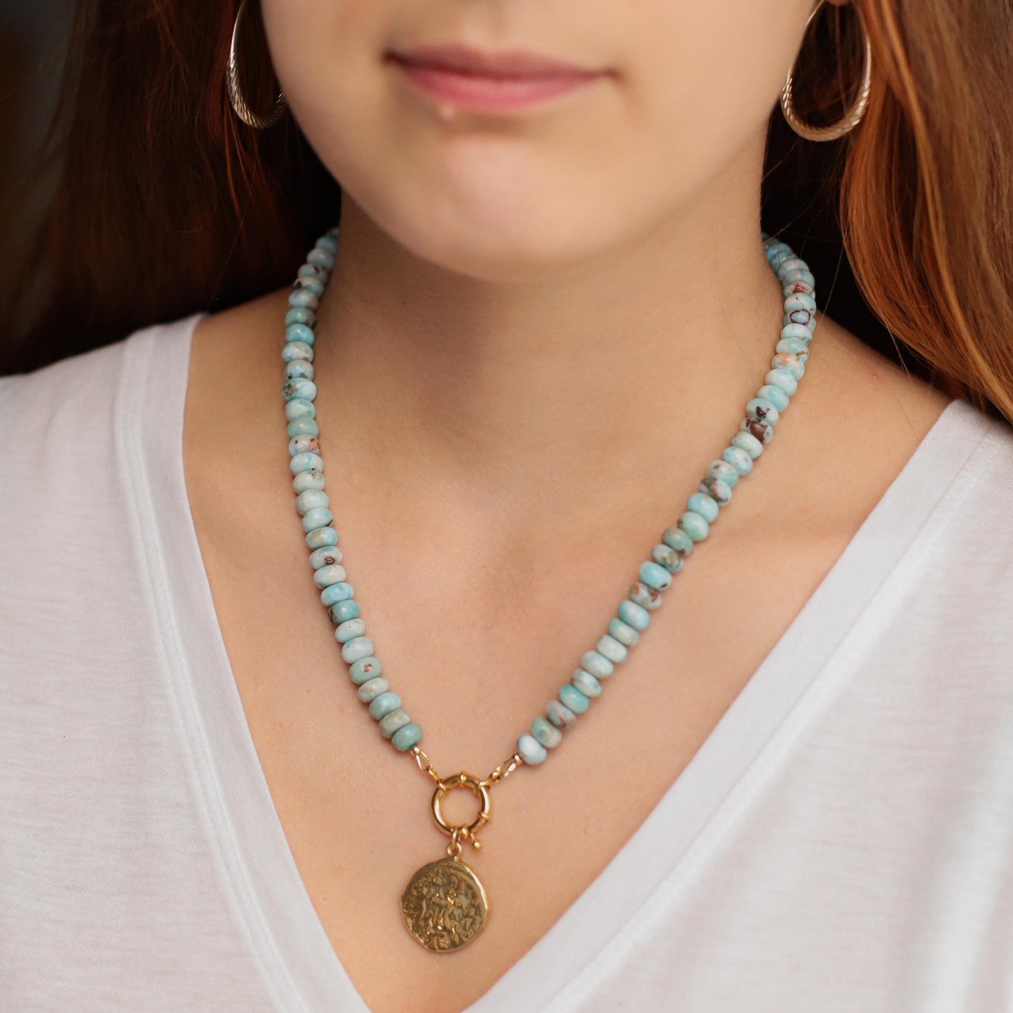 Larimar toggle necklace by Earthly Abundance featuring a blue gemstone pendant on a silver chain.