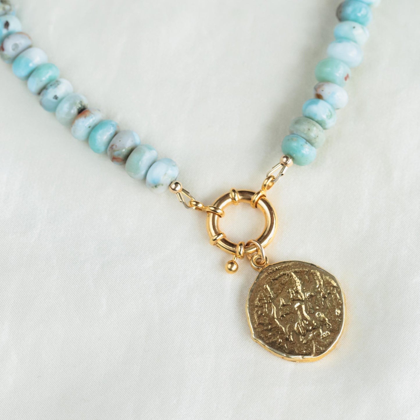 Larimar toggle necklace featuring a blue stone pendant on a silver chain, crafted by Earthly Abundance.