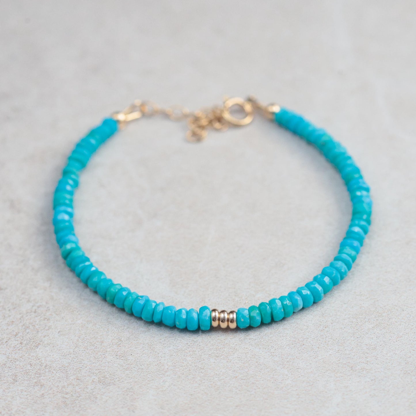 Sleeping Beauty turquoise bracelet in 14K gold with round turquoise stones, elegant jewelry piece by Earthly Abundance.