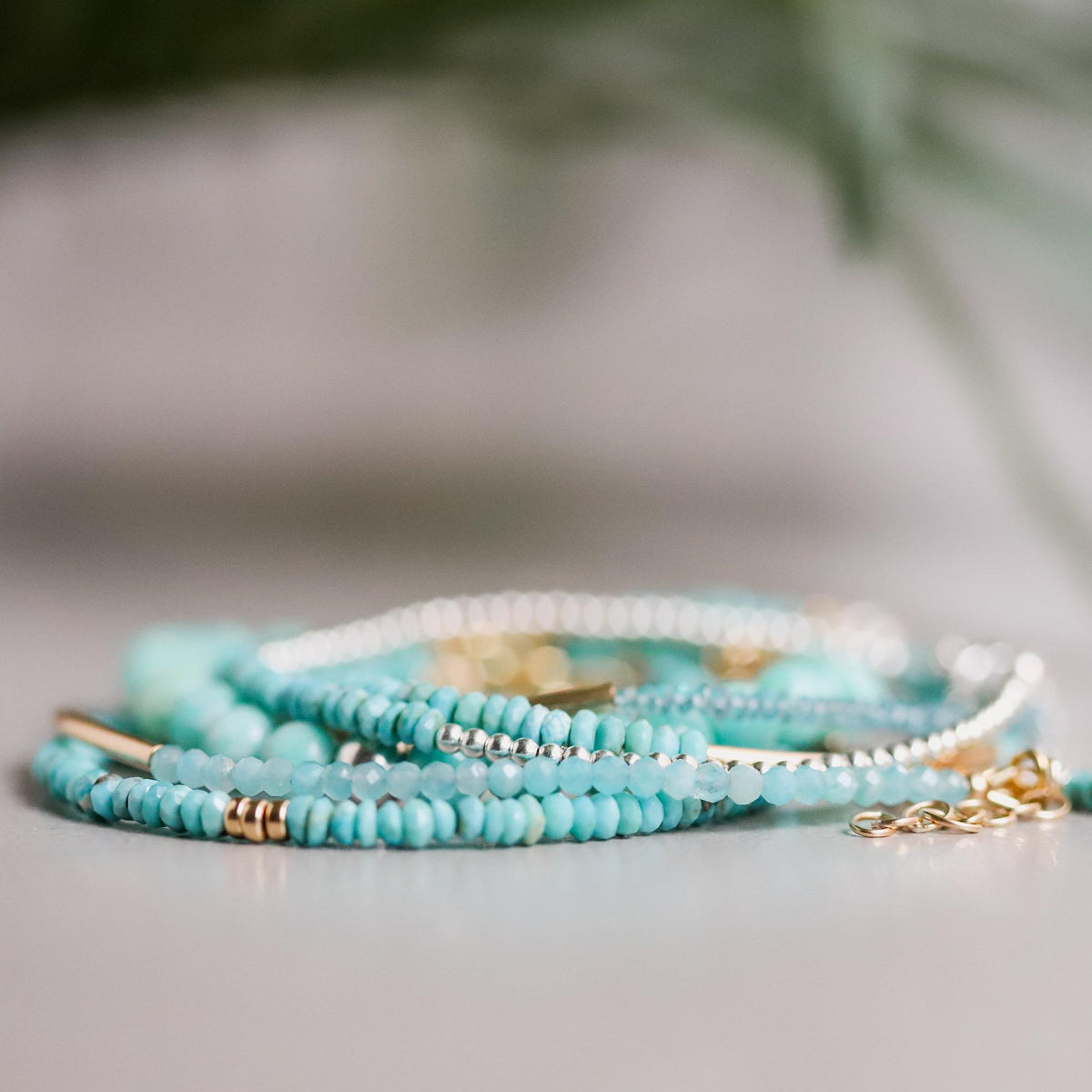 Sleeping Beauty turquoise bracelet with 14K gold setting, featuring vibrant blue turquoise stones, by Earthly Abundance.