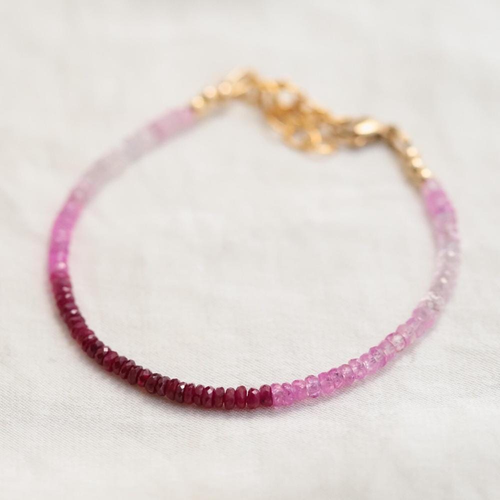 Raspberry Mist Ruby bracelet by Earthly Abundance featuring vibrant ruby beads on a 14K gold chain.