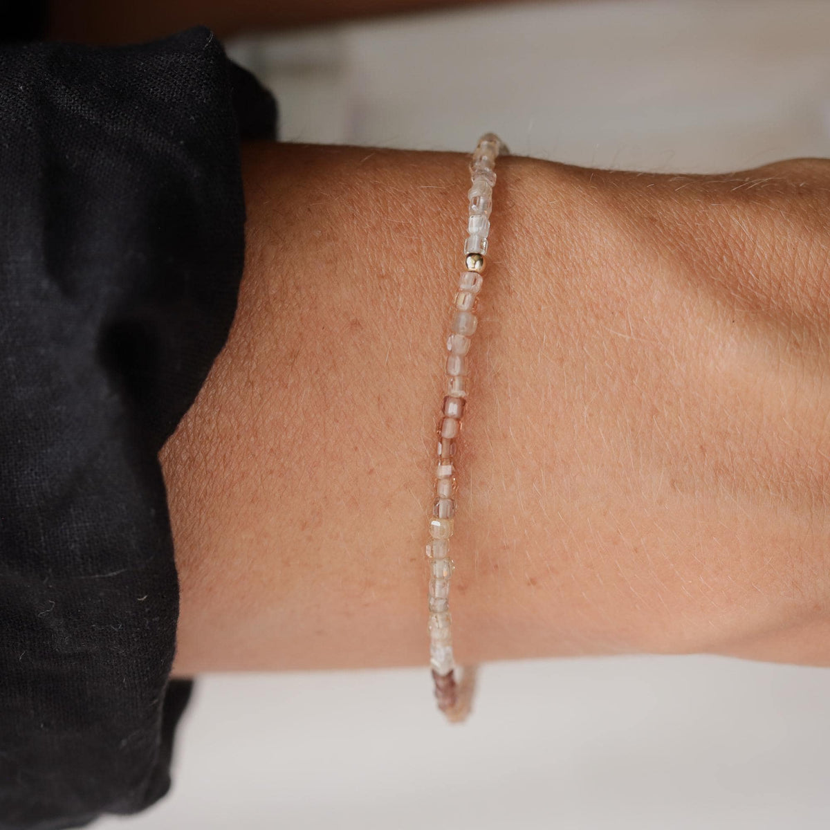 Earthly Abundance Zircon Cube Stretch Bracelet with 14K gold accents, showcasing sparkling cubic zirconia stones on a flexible band.