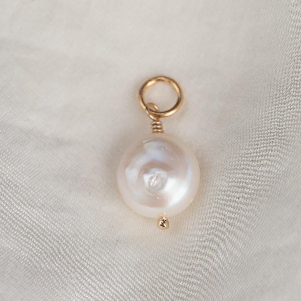 Freshwater pearl pendant on 14K gold chain, elegant jewelry piece by Earthly Abundance with a lustrous pearl centerpiece.