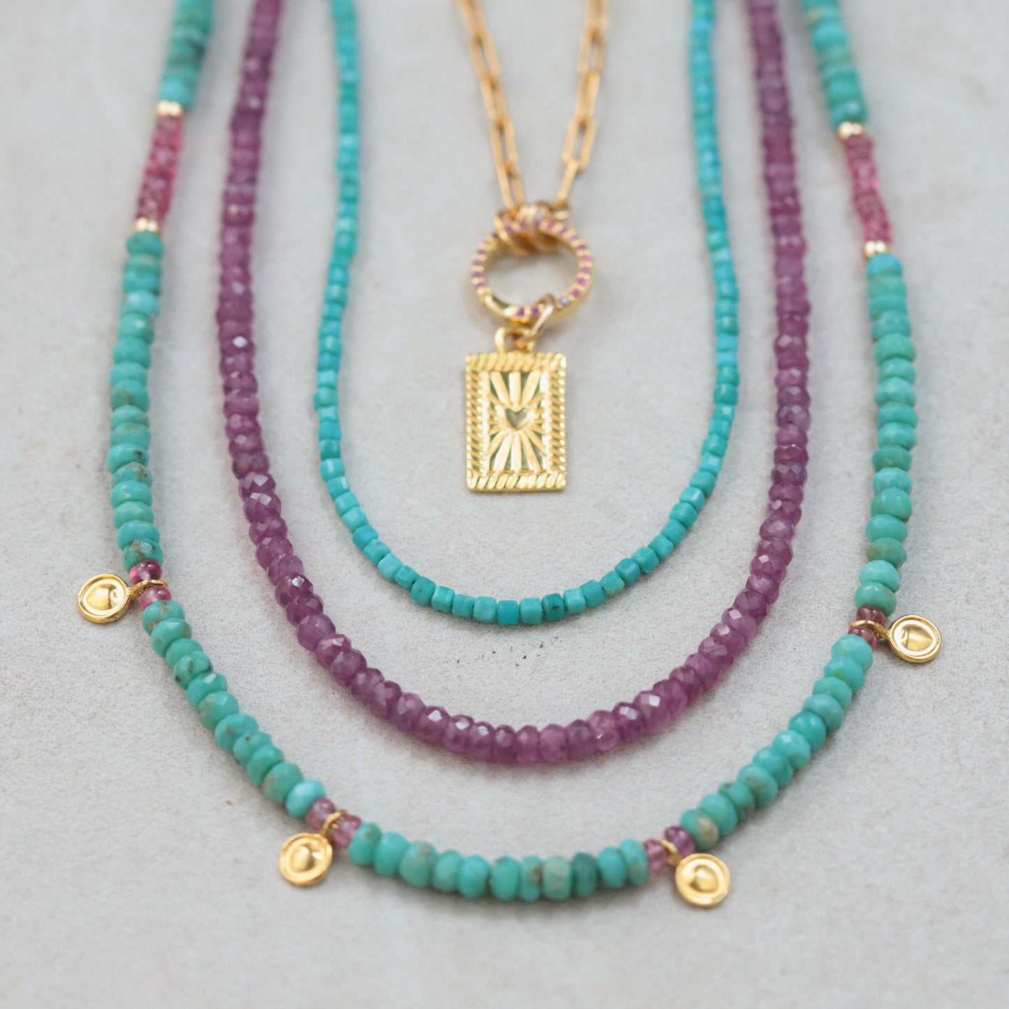 Turquoise and pink sapphire necklace featuring vibrant gemstones on a delicate chain, by Earthly Abundance.