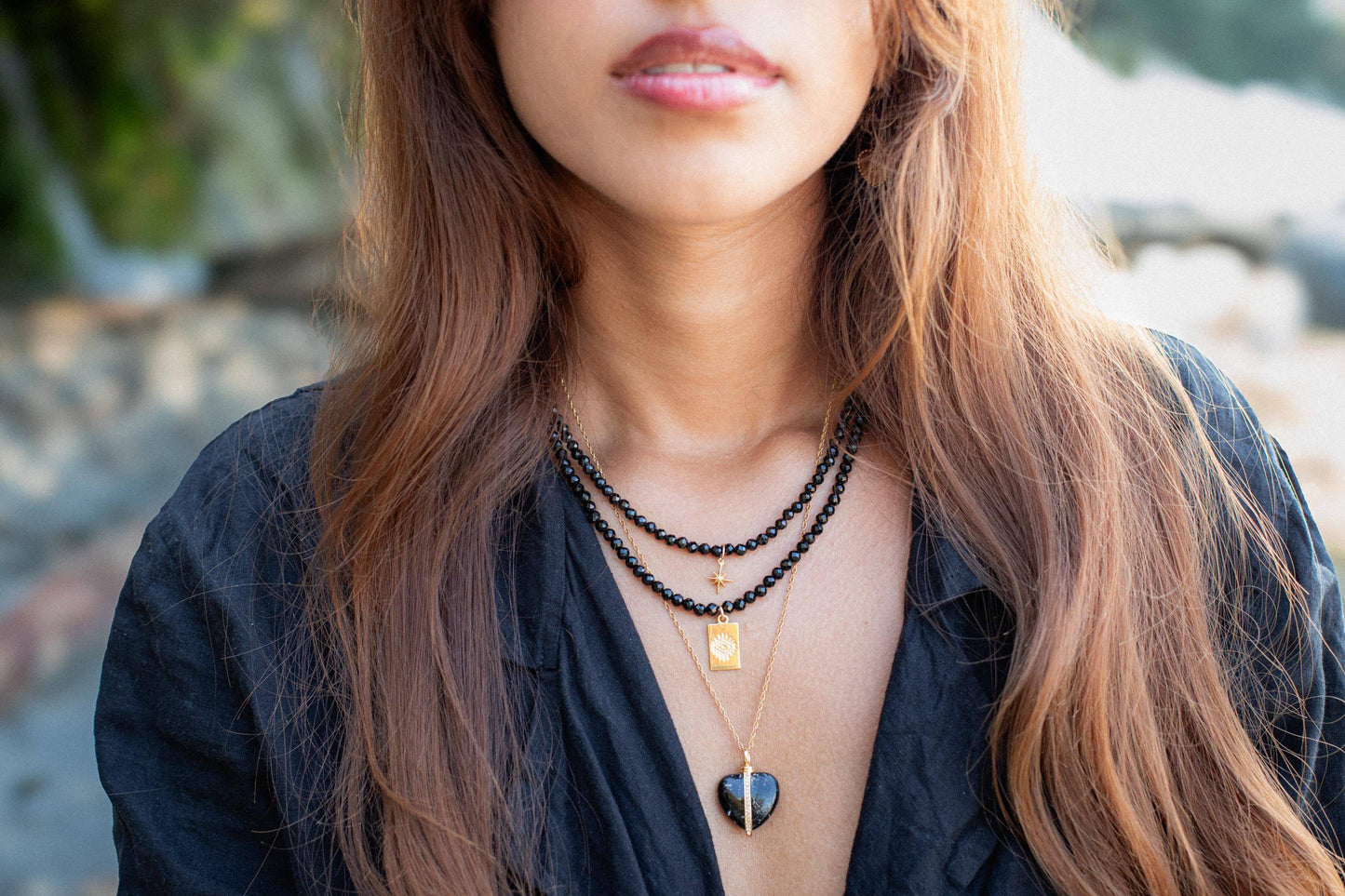 Evil Eye Black Tourmaline necklace by Earthly Abundance featuring a dark protective charm on a delicate chain.