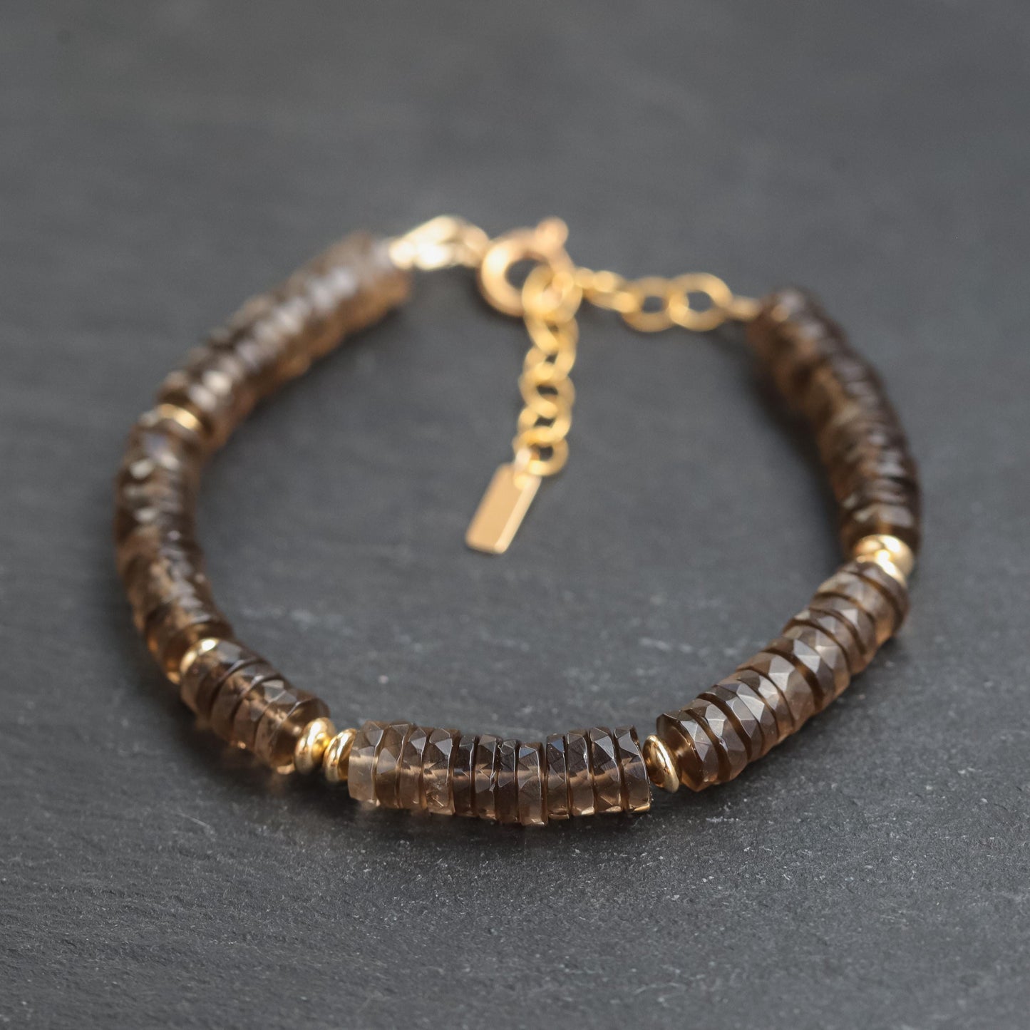 Smoky Quartz bracelet from Earthly Abundance featuring polished, natural gemstone beads on an elastic band.
