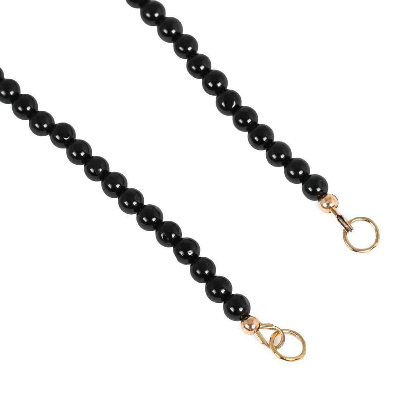 Black Tourmaline Carabiner Necklace from Earthly Abundance Jewelry featuring a sleek black gemstone pendant on a metal chain.