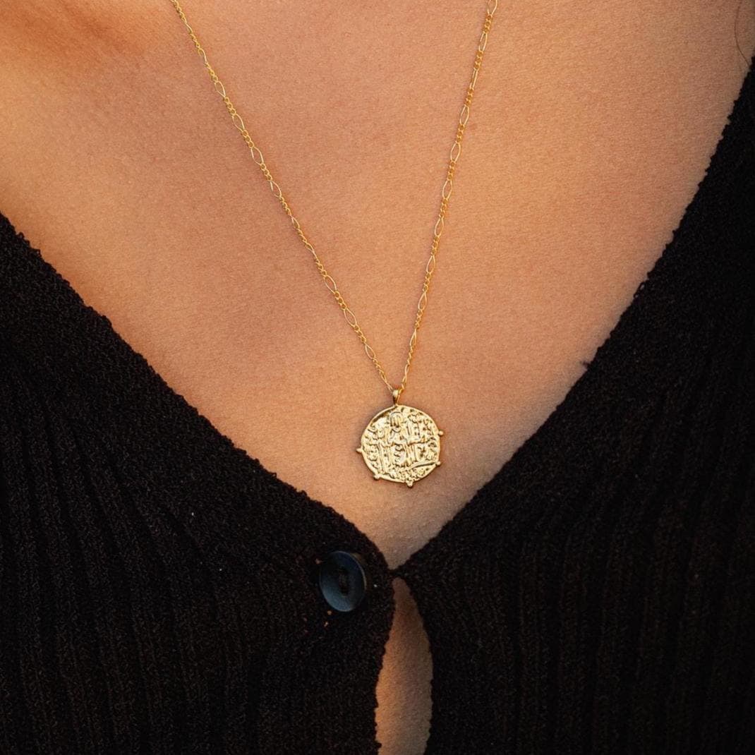 Greek style pendant necklace from Earthly Abundance featuring a detailed pendant on a delicate chain.