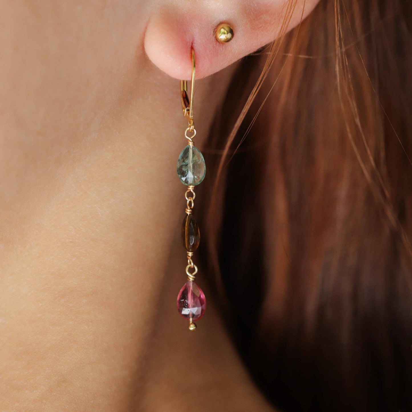 Delicate mixed tourmaline drop earrings from Earthly Abundance featuring colorful gemstone beads and gold-tone hooks.