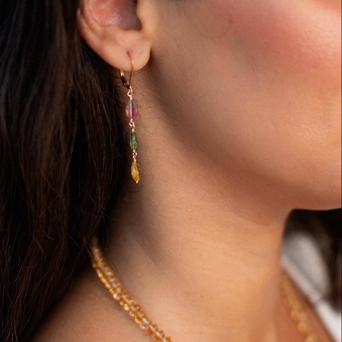 Delicate mixed tourmaline drop earrings by Earthly Abundance featuring colorful gemstone beads and silver hooks.