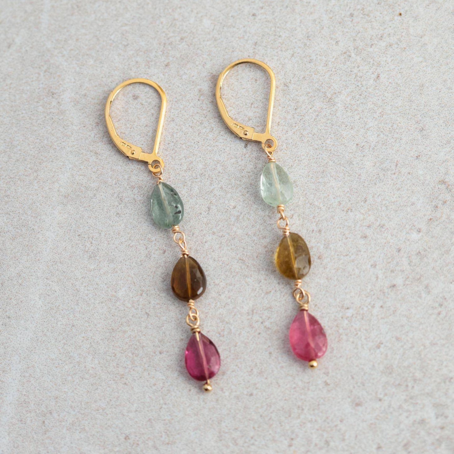 Delicate mixed tourmaline drop earrings by Earthly Abundance featuring colorful gemstone dangles and sterling silver hooks.
