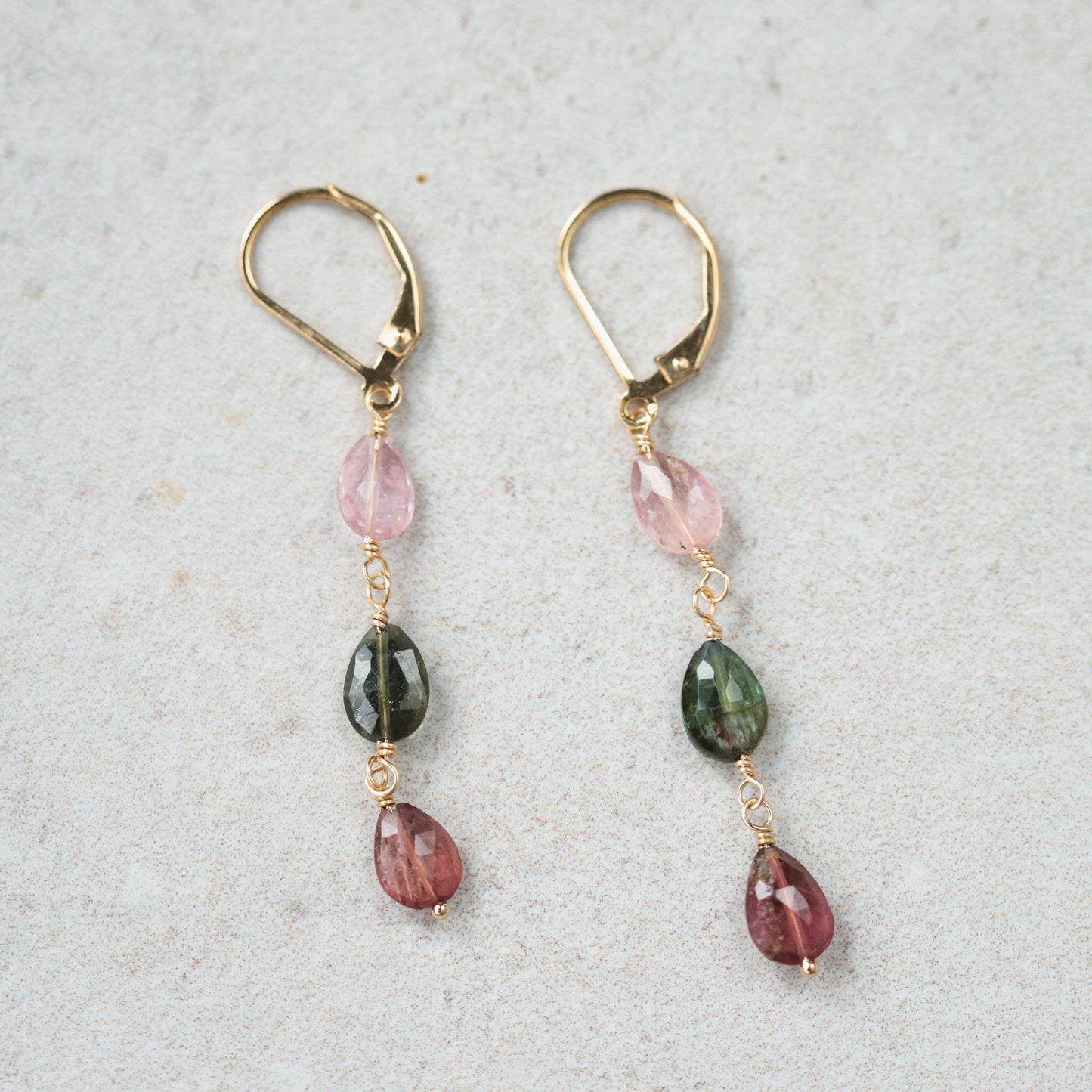 Delicate mixed tourmaline drop earrings by Earthly Abundance featuring colorful gemstone beads and gold-tone hooks.