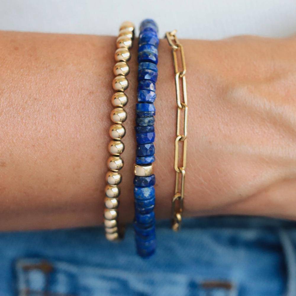 Lapis Lazuli Heishi beads from Earthly Abundance Jewelry, showing smooth, round blue gemstone jewelry strands.