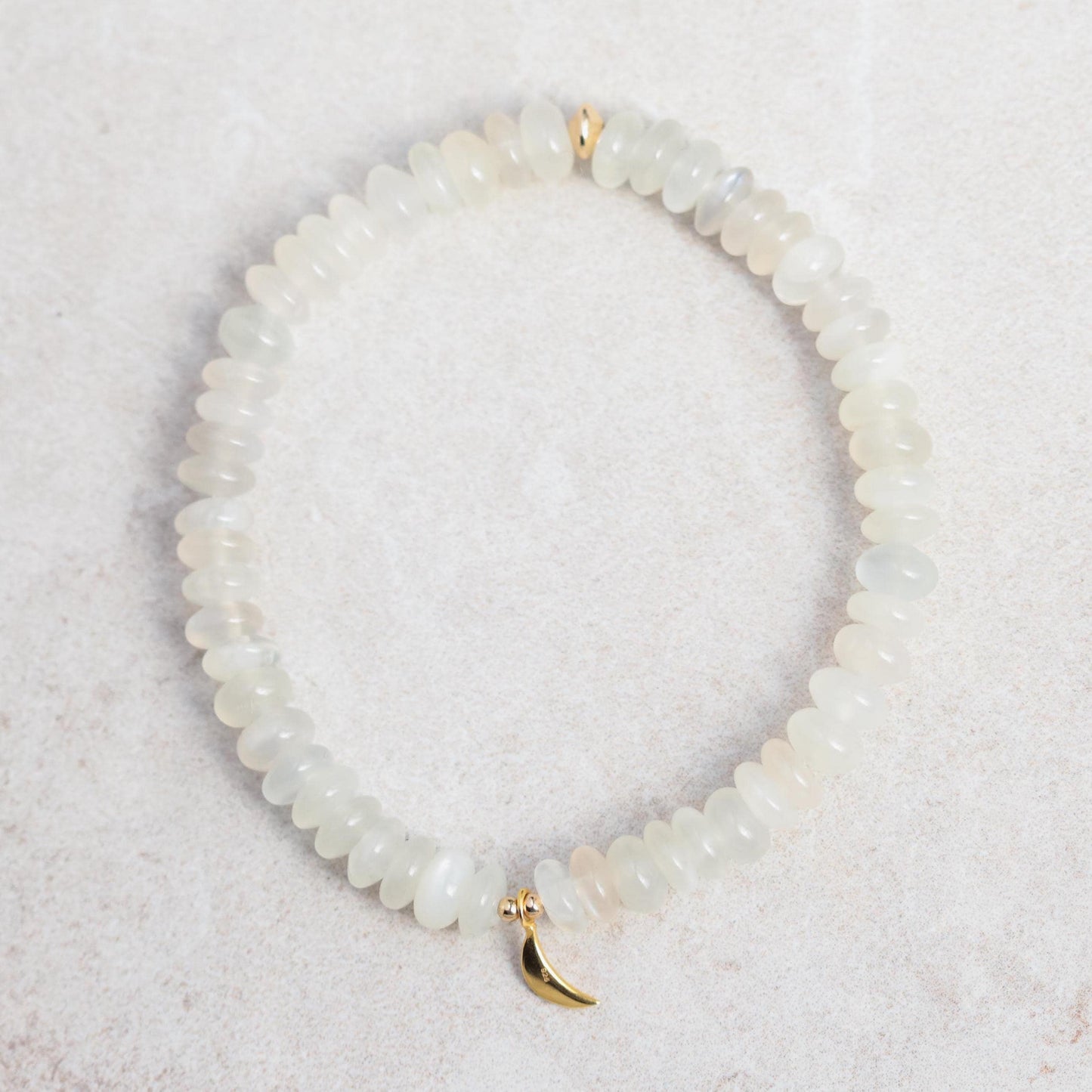 Beautiful moonstone bracelet from Earthly Abundance featuring polished moonstone beads on a stretchy band.