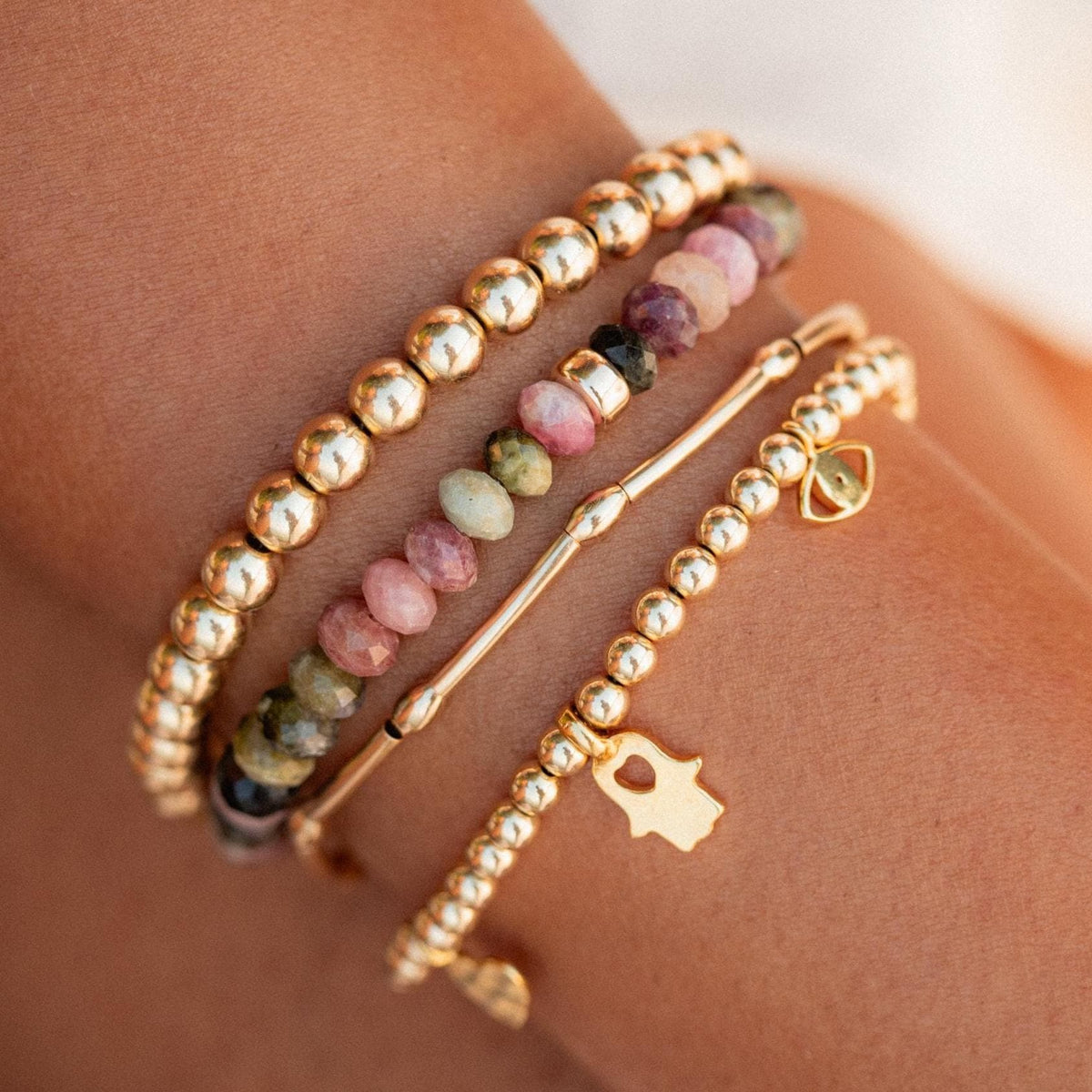 Mixed tourmaline bracelet from Earthly Abundance featuring colorful gemstone beads and a stretch elastic band.