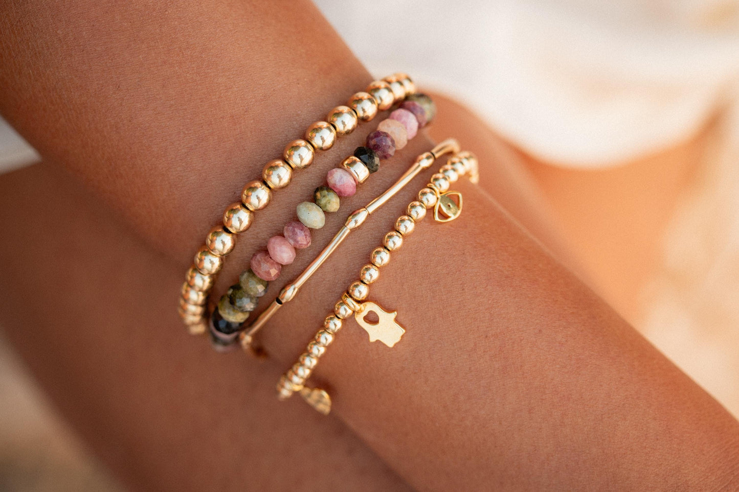 Mixed Tourmaline bracelet by Earthly Abundance with colorful gemstone beads on an elastic cord.