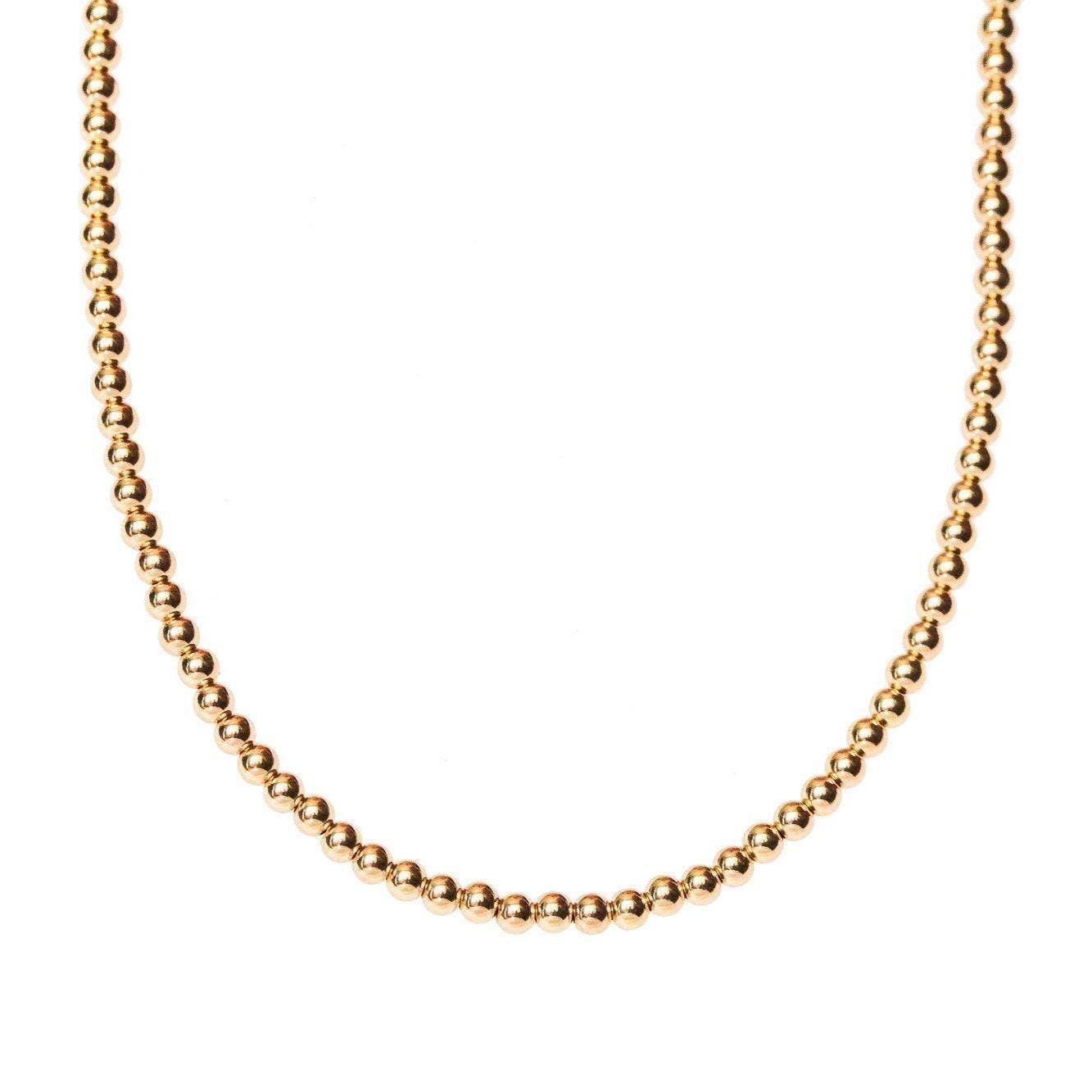 14k gold filled necklace from Earthly Abundance Jewelry, close-up view showcasing delicate chain and elegant design.