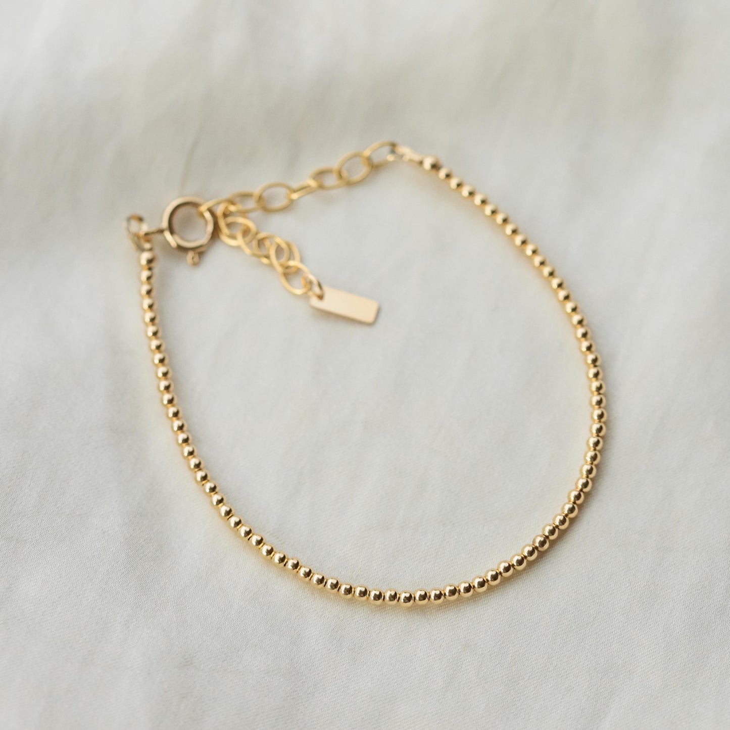 Adjustable gold-filled beaded ball bracelet with fine beading and a secure clasp, crafted by Earthly Abundance.
