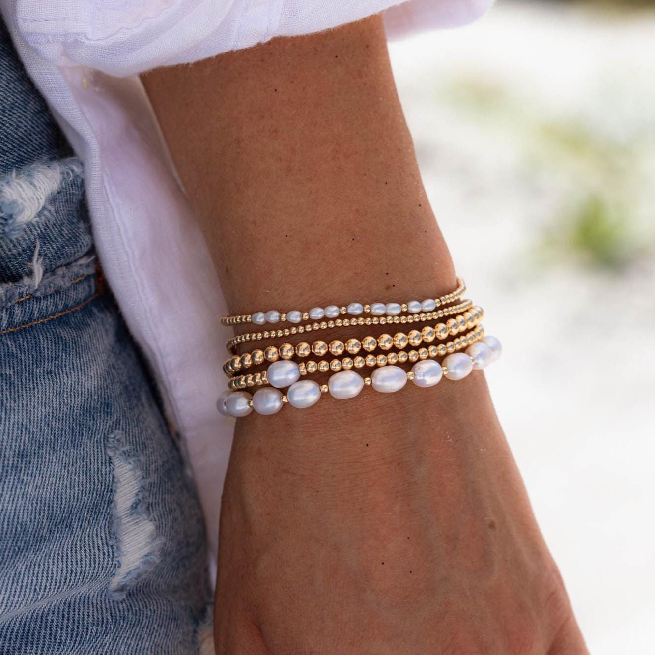 Adjustable gold filled beaded ball bracelet with small round beads, featuring a delicate and elegant design by Earthly Abundance.