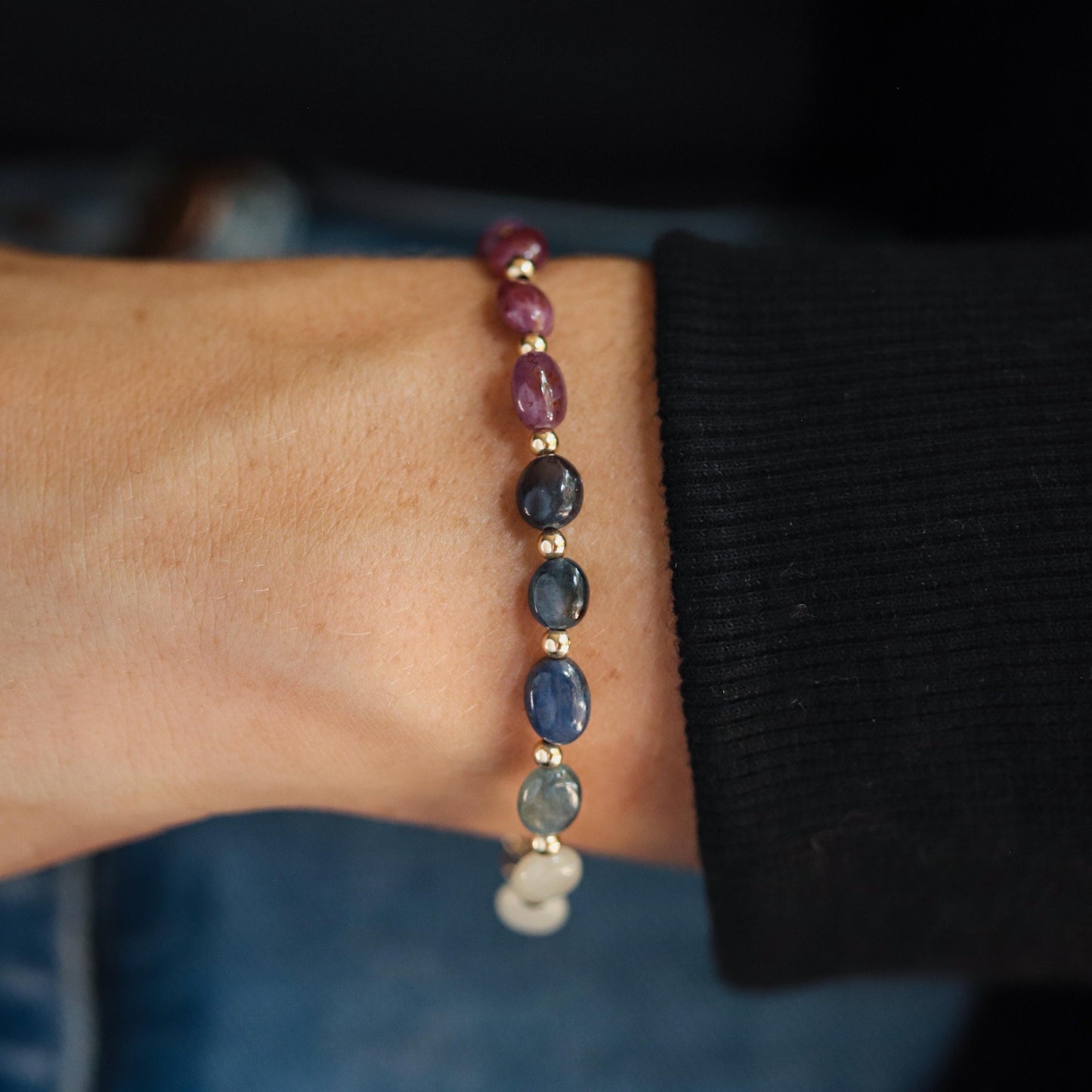 Elegant multi sapphire oval bracelet by Earthly Abundance featuring vibrant blue sapphires and a delicate silver chain.