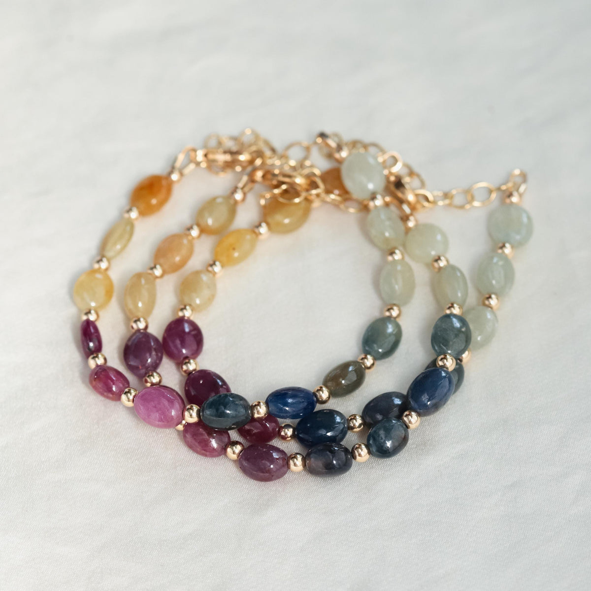 Elegant multi sapphire oval bracelet featuring vibrant blue sapphires set in a stylish gold bracelet by Earthly Abundance.