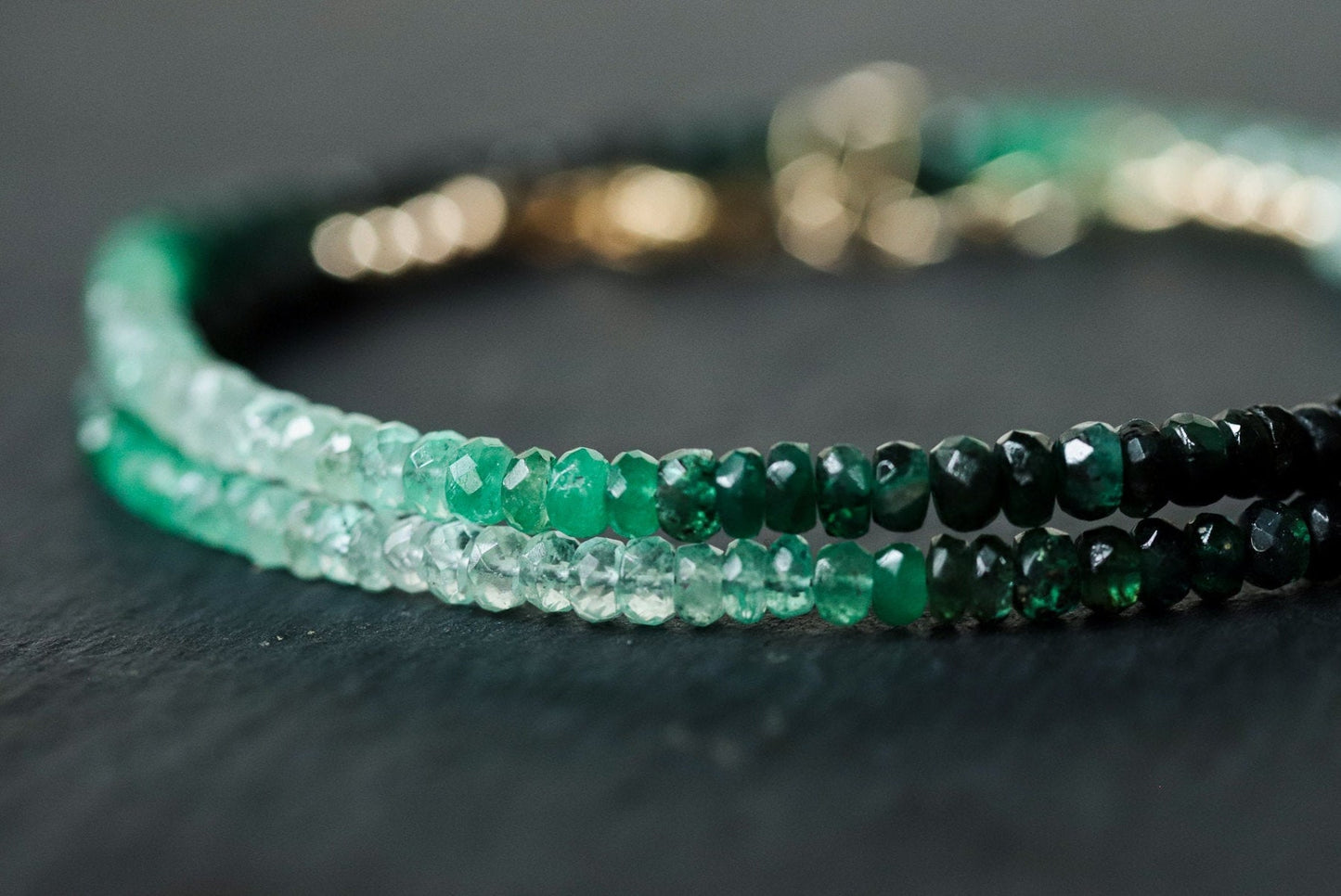 Emerald heart-shaped 14K gold carabiner necklace with a secure clasp, designed by Earthly Abundance.
