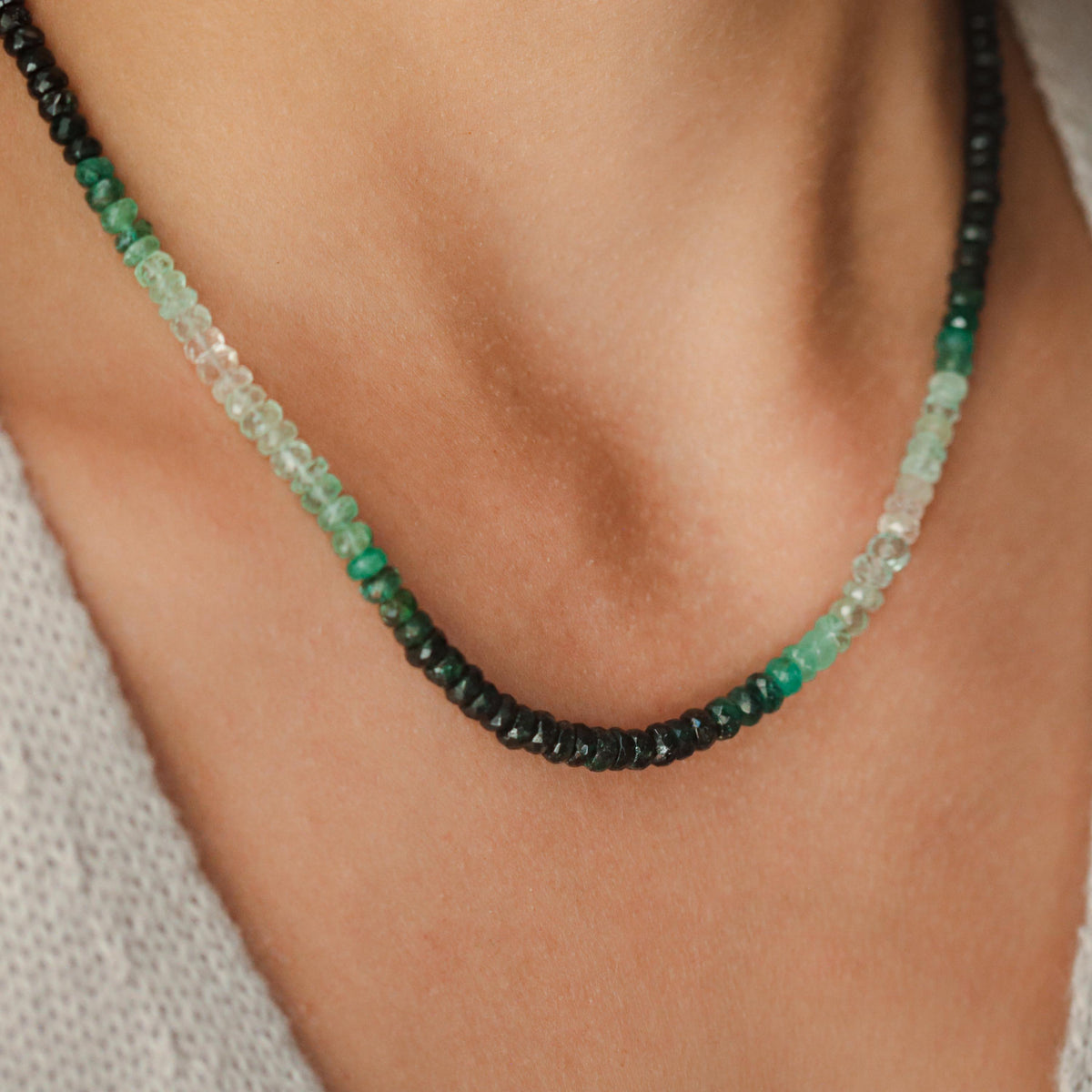 Emerald heart-shaped carabiner necklace in 14K gold with delicate chain, from Earthly Abundance.
