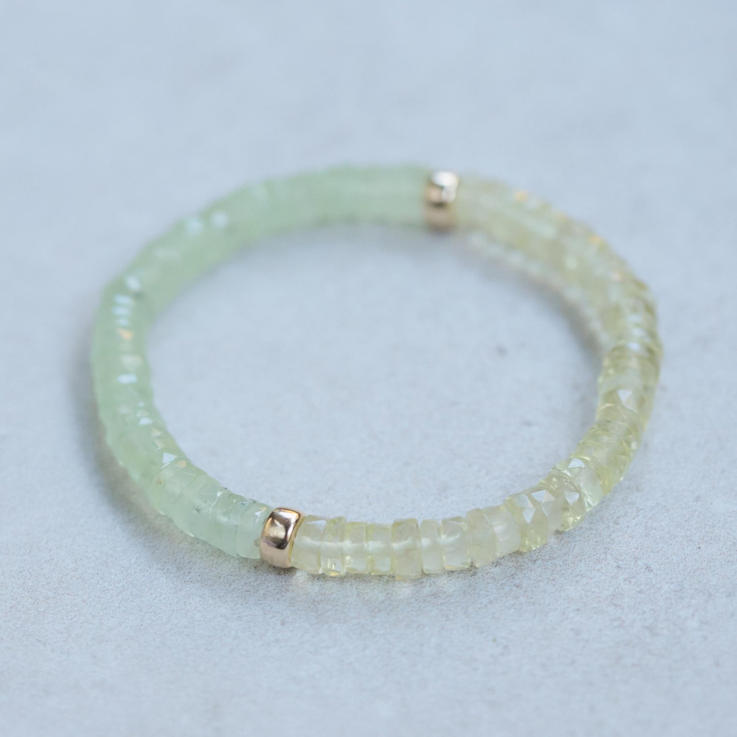 Prehnite and lemon quartz beaded bracelet from Earthly Abundance with polished stones and elastic band for a stylish, natural look.