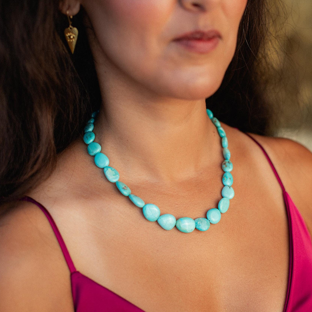 Turquoise Sol Necklace in 14K gold by Earthly Abundance, featuring a vibrant turquoise pendant on a delicate gold chain.