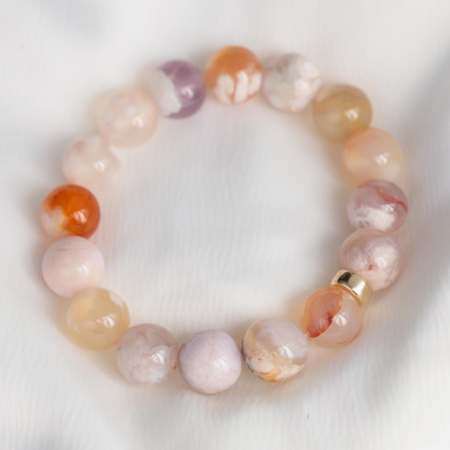 Flower agate bracelet with 14K gold accents, featuring colorful floral-patterned agate beads from Earthly Abundance.