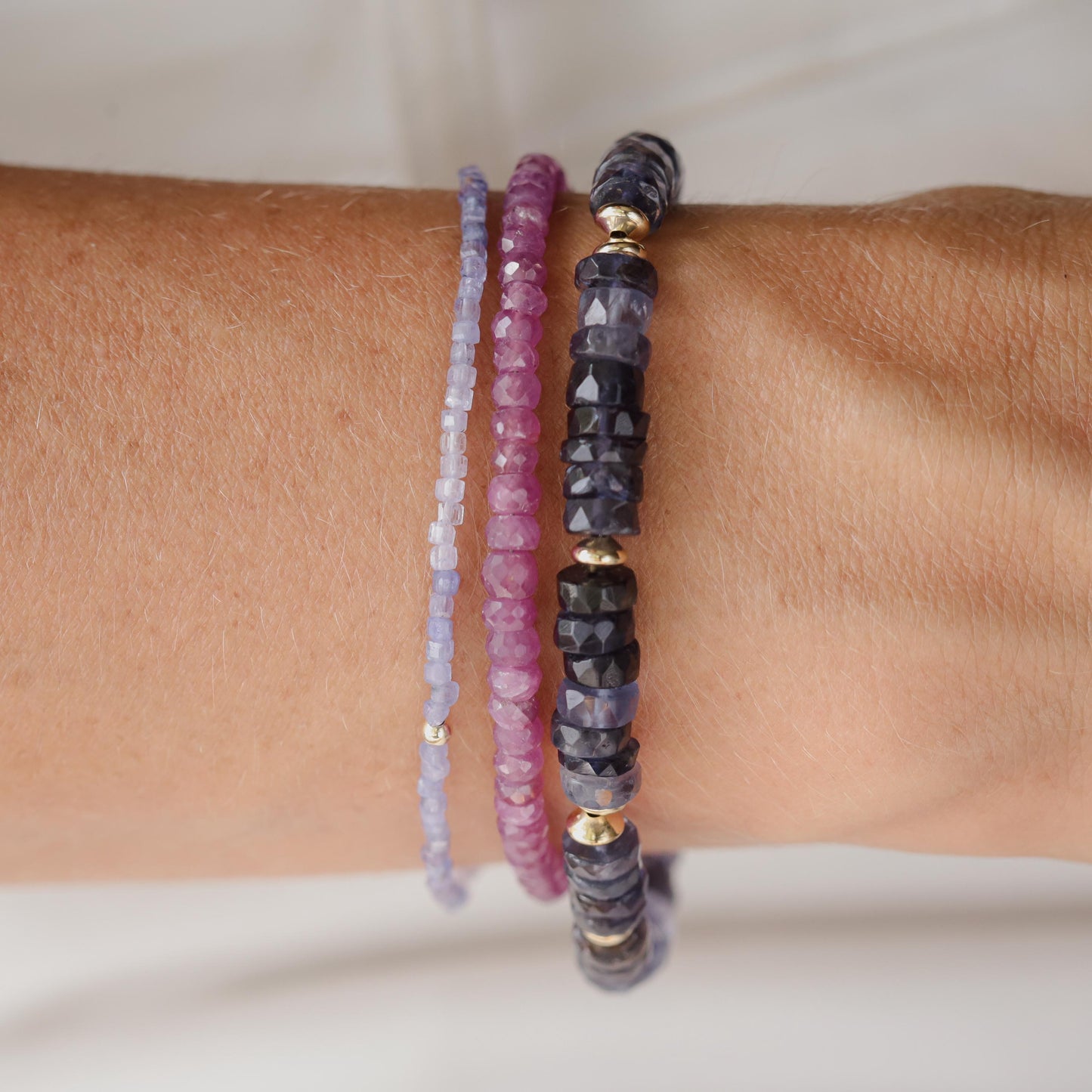 African Ruby bracelet featuring polished red gemstones on a delicate string, designed by Earthly Abundance.
