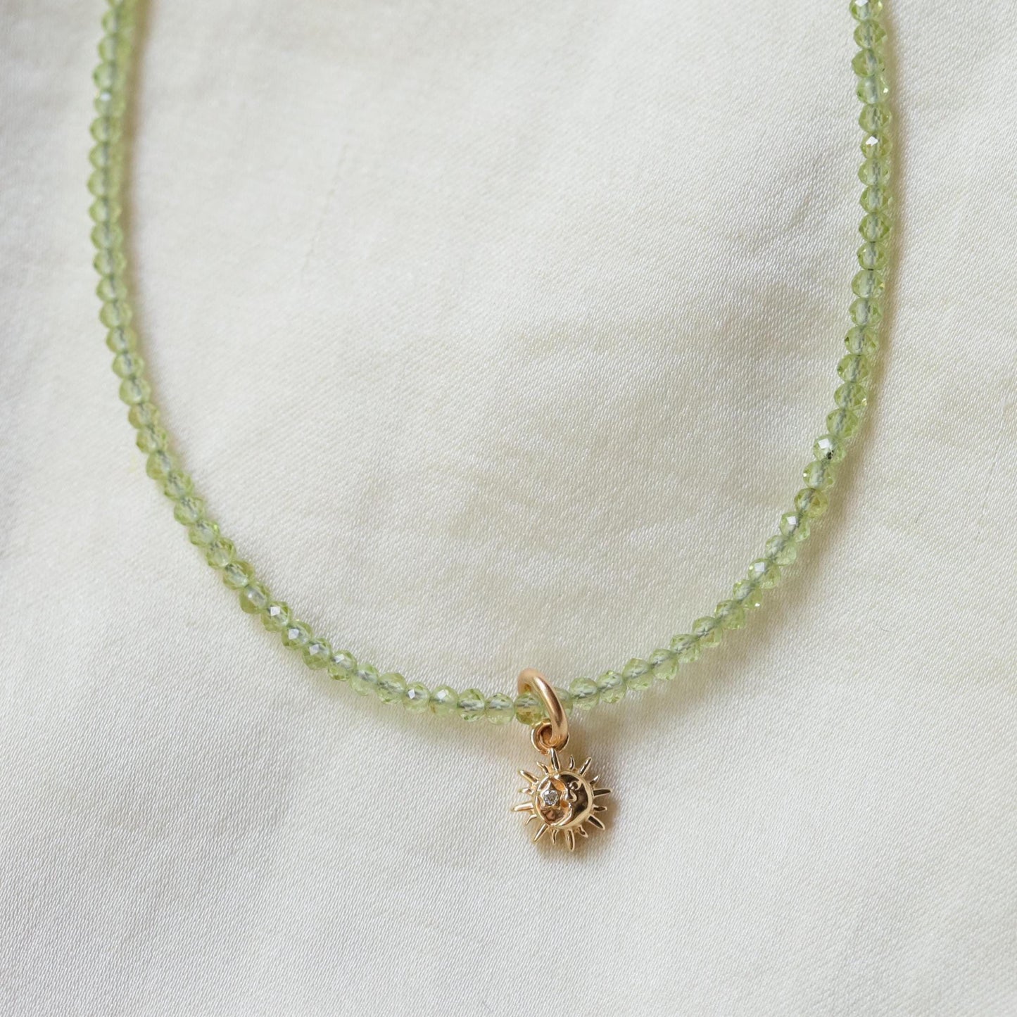 Sun Moon Diamond Peridot Necklace in 14K gold with sparkling diamonds and vibrant peridot, elegant jewelry for special occasions.