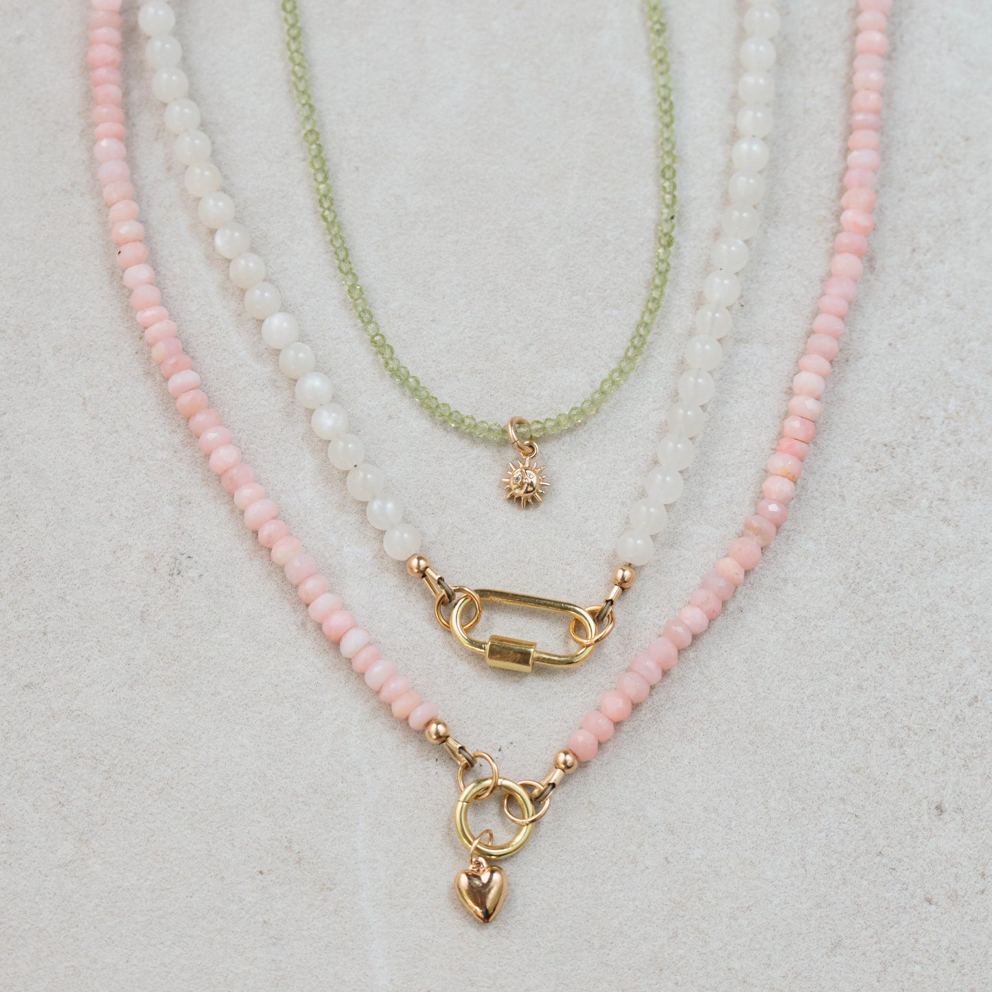 Sun Moon Diamond Peridot Necklace in 14K gold featuring a celestial pendant with diamonds and peridot gemstone.