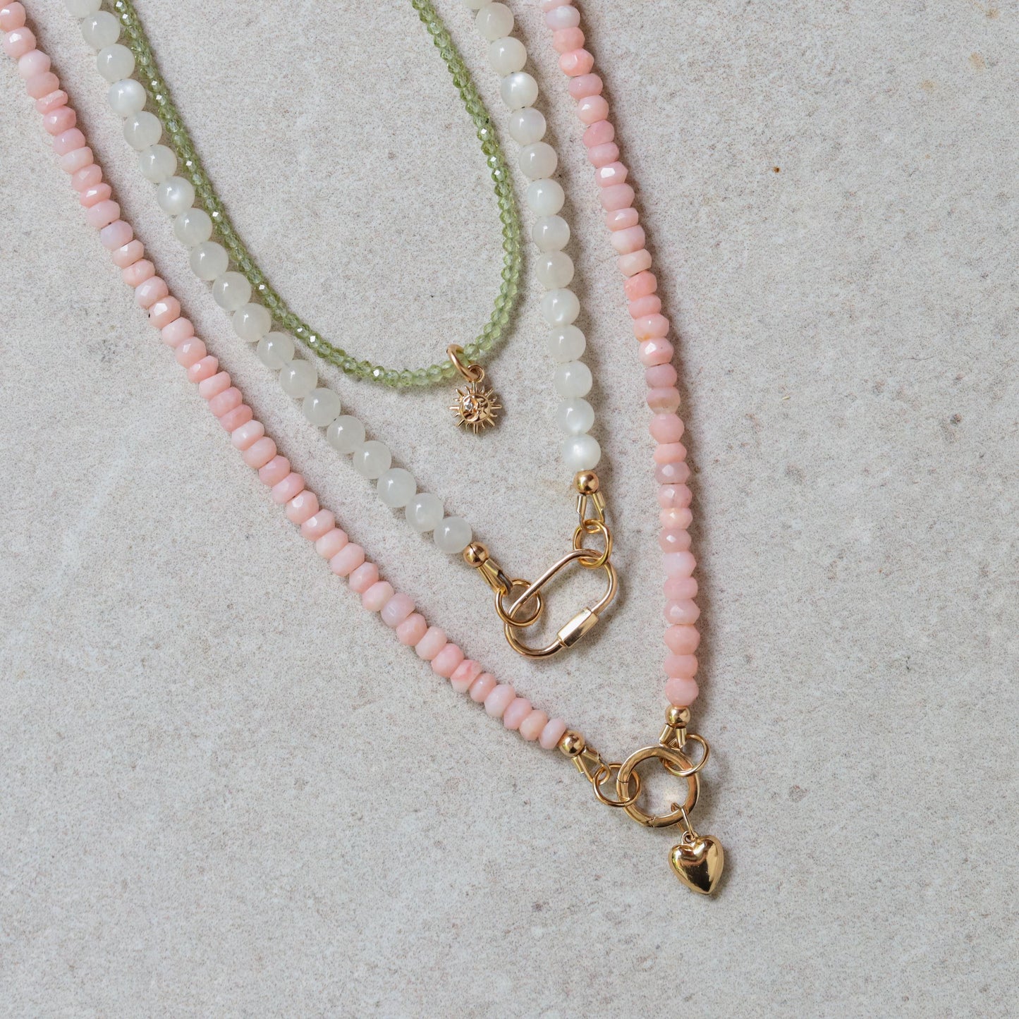 Sun Moon Diamond Peridot Necklace in 14K gold featuring a celestial pendant with peridot and diamond accents, by Earthly Abundance.