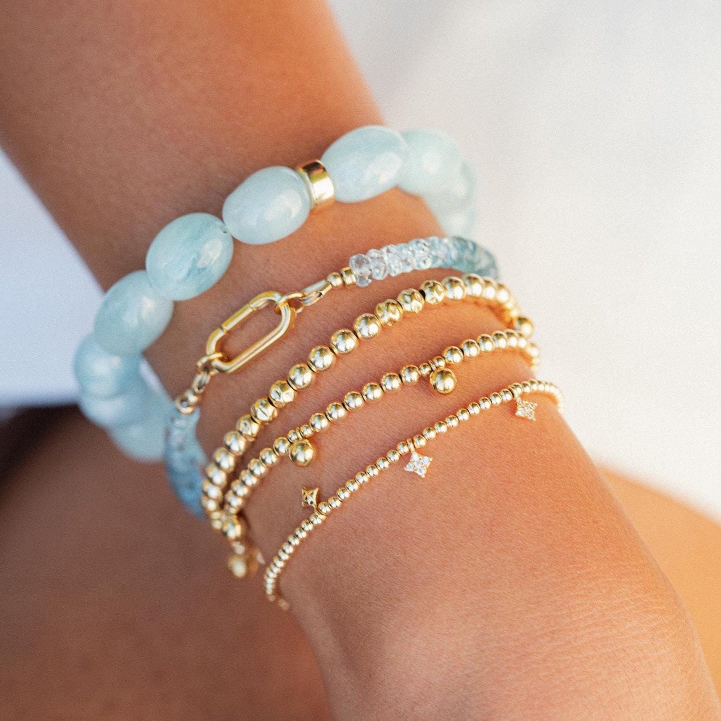 Aquamarine nugget bracelet with 14K gold clasp by Earthly Abundance, featuring polished blue aquamarine stones on a delicate chain.
