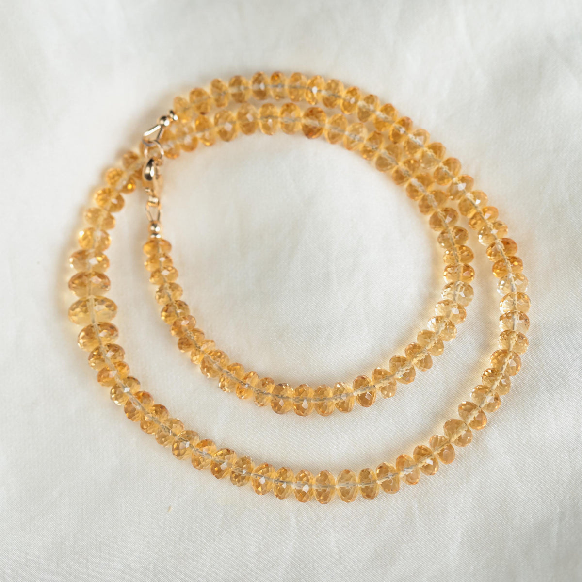 Citrine Honey Glow necklace by Earthly Abundance featuring a warm, faceted citrine pendant on a delicate chain.