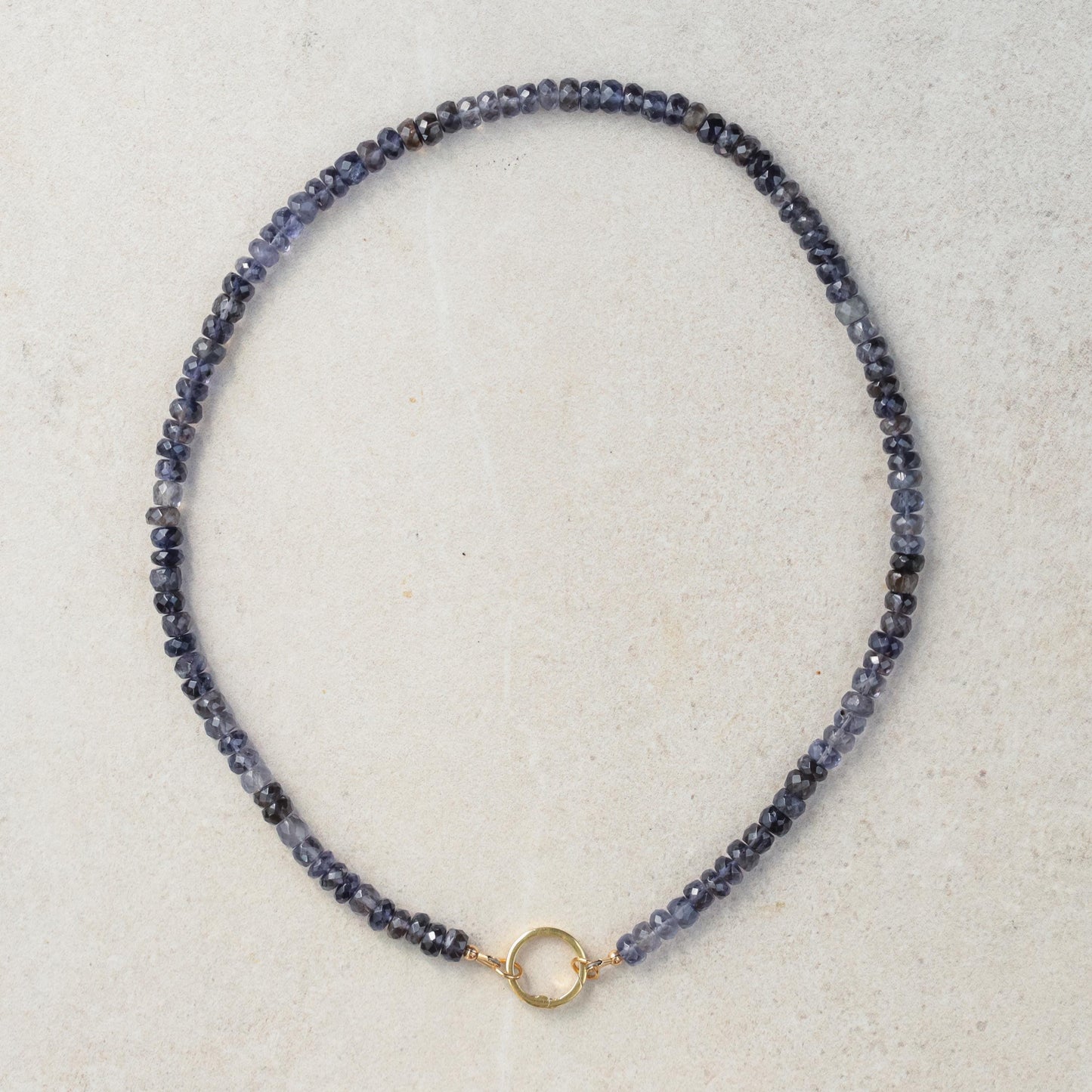 Ombre Iolite Carabiner Necklace featuring a vibrant blue-purple gemstone pendant on a silver chain.