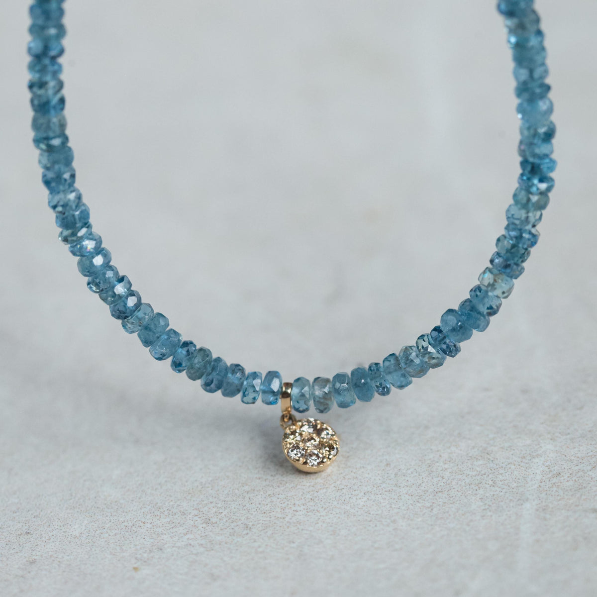 Santa Maria aquamarine and diamond necklace by Earthly Abundance featuring a sparkling aquamarine pendant with diamond accents.