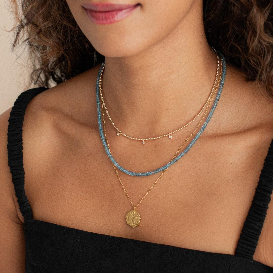 Santa Maria aquamarine necklace in 14K gold with a delicate chain, featuring a vibrant aquamarine pendant.