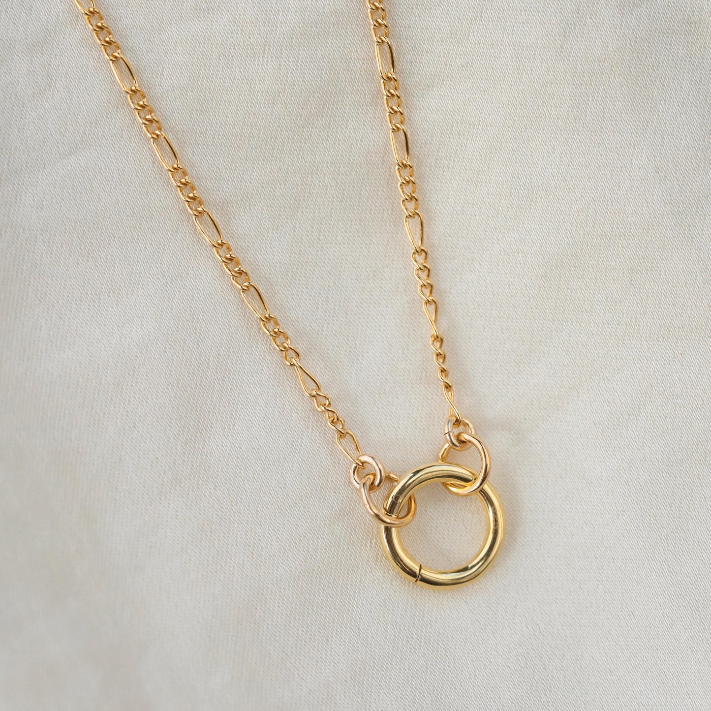 14k gold filled Figaro chain necklace from Earthly Abundance, featuring interlinked oval links on a delicate jewelry chain.
