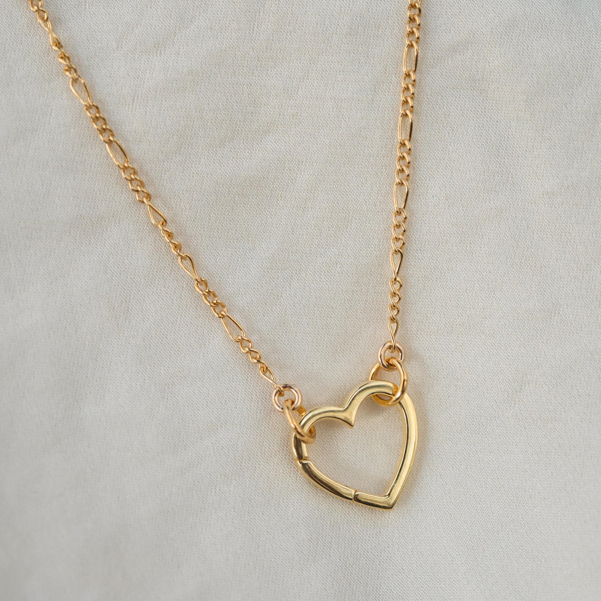14k gold filled Figaro chain necklace by Earthly Abundance, showing its intricate links and shiny gold finish.