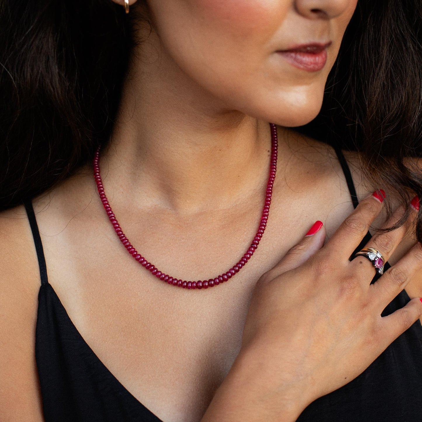 Earthly Abundance Crown Longido Ruby Necklace in 14K gold featuring a vibrant ruby pendant on a delicate chain.