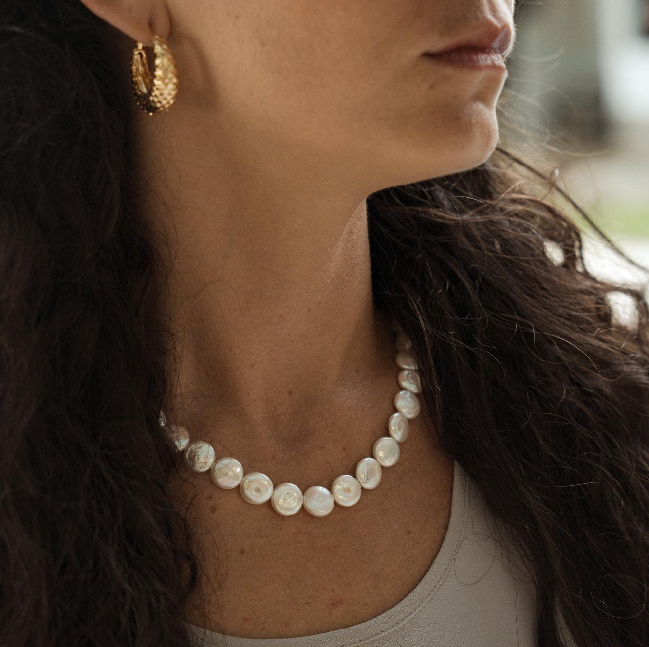Freshwater disc pearl necklace by Earthly Abundance featuring white pearls on a delicate chain, elegant and timeless jewelry piece.